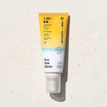 EcoSun Spray SPF 50+ SeventyOne Percent, protection solaire minérale corps 100 ml, flacon posé sur une pierre blanche au soleil