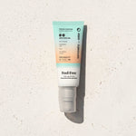 Feel Free SPF 50 SeventyOne Percent, crème de jour hydratante à l'acide hyaluronique 40 ml, tube posé sur une pierre blanche au soleil